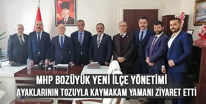 MHP Bozüyük yeni ilçe yönetimi ayaklarının tozuyla kaymakam Yamanı ziyaret etti